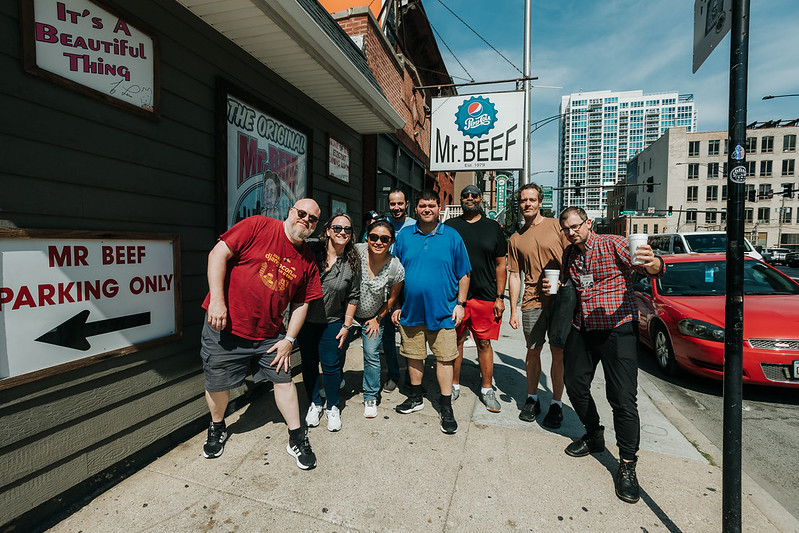 Group of attendees posing outside Mr. Beef restaurant in Chicago