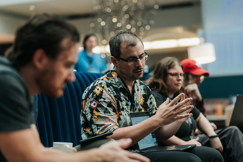 Attendees having a discussion during sprints